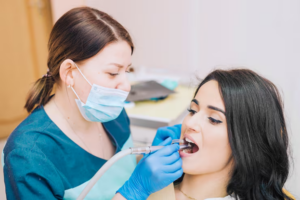 1. Deep Cleaning Teeth (Scaling and Root Planing): This procedure involves deep cleaning below the gum line to remove tartar and plaque buildup. This initial step is often sufficient for early stage gum disease. 2. Antibiotic Treatments: To control bacterial infection, antibiotics may be used as a supplement to scaling and root planing. Understanding various gum disease solutions can aid in catching and treating the symptoms early before they escalate. For more on prevention and treatment options, explore this guide. Advanced Treatments 1. Surgical Treatments: In more advanced stages, surgical interventions may become necessary. This includes flap surgery for cleaning under the gums and bone grafts to replace or regenerate bone destroyed by periodontitis. 2. Receding Gums Treatment: Grafting procedures can also help cover roots or develop gum tissue where it has receded due to excessive brushing or gum disease. Importance of Professional Care Professional dental care is vital in treating gum disease and ensuring oral health problems don't lead to more severe health issues. Our team at Dolphin Dentistry offers extensive periodontics and gum disease treatment services in Ottawa, designed to maintain the longevity of your smile. Preventive Measures To prevent gum disease and other oral health issues, consider the following: • Regular Dental Visits: Routine check-ups at Dolphin Dentistry can help identify potential problems before they become serious. • Effective Oral Hygiene: Brushing twice a day, flossing daily, and using an antibacterial mouthwash can significantly reduce plaque and bacteria in your mouth. • Adjusting Habits: Avoiding tobacco, maintaining a balanced diet, and managing stress are essential components of reducing the risk of periodontal disease. Comprehensive Care at Dolphin Dentistry We understand that each patient's situation is unique. That's why our personalized oral health services ensure that you receive the best care tailored to your specific needs. Whether you need routine check-ups or specialized periodontal treatment, our expert team is here to guide you through your dental health journey. By recognizing the early signs of gum disease and seeking timely treatment, you are taking a proactive step towards safeguarding your smile. For further inquiries or to schedule an appointment, visit us at 318 McLeod St, Ottawa, or contact us at +1(613) 234-5758. With Dolphin Dentistry, you're not just visiting a dentist – you're investing in a partner dedicated to your lasting health and happiness.
